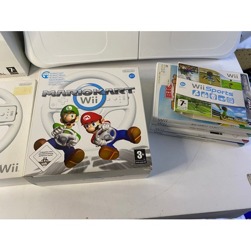 170 - Nintendo Wii with games and accessories including fit board, Mariokart, sport pack and more. Tested ... 