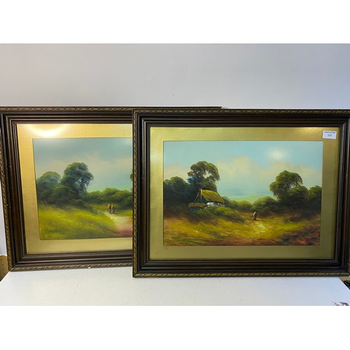 205 - 2 framed paintings of countryside scenes c.1920s. Appears to be unsigned 63x48cms.