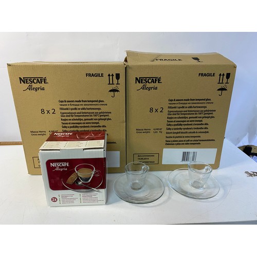 206 - 2 boxes of Nescafe Alegria glass cups and saucers. Each box contains 8 sets of 2 cups and saucers.