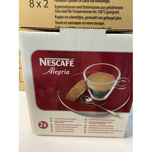 206 - 2 boxes of Nescafe Alegria glass cups and saucers. Each box contains 8 sets of 2 cups and saucers.