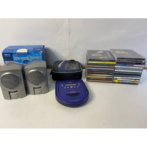 240 - Mbox portable CD player with mini stereo speakers and a selection of CDs, in working order.