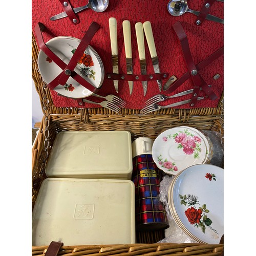 500 - Vintage wicker picnic hamper with selection of plates, thermos, tupperware boxes, cutlery