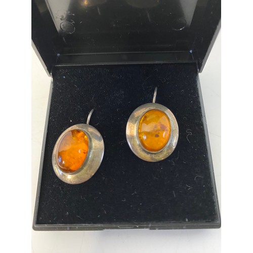 54 - Sterling silver and amber ear-rings.