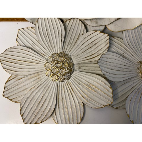 82 - Trio of metal wall flowers. largest is 56cms across