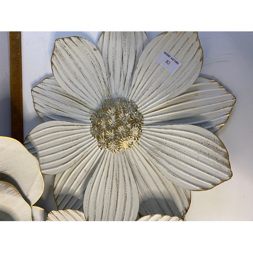 82 - Trio of metal wall flowers. largest is 56cms across