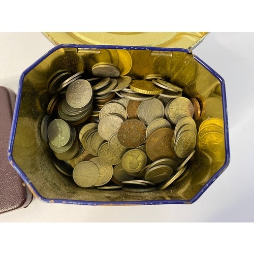 14 - Tin of old coins and coin display case.