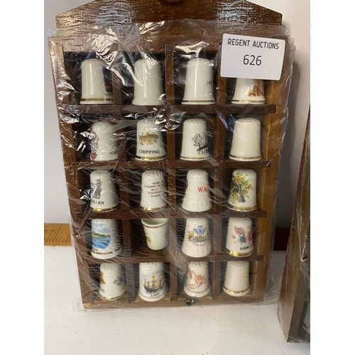 626 - Assortment of thimbles in display racks