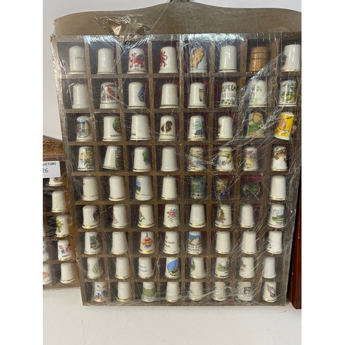 626 - Assortment of thimbles in display racks