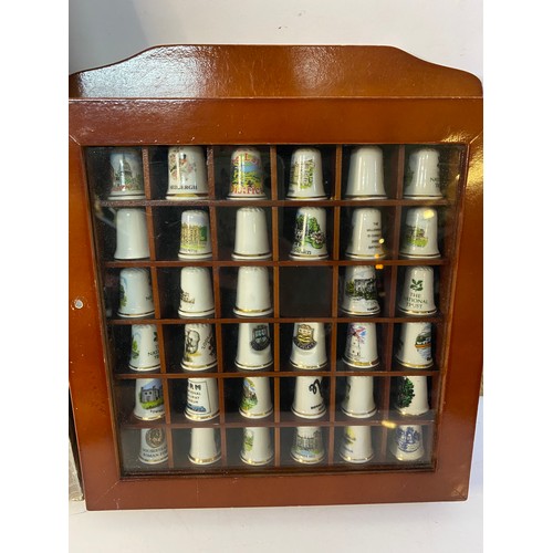 626 - Assortment of thimbles in display racks