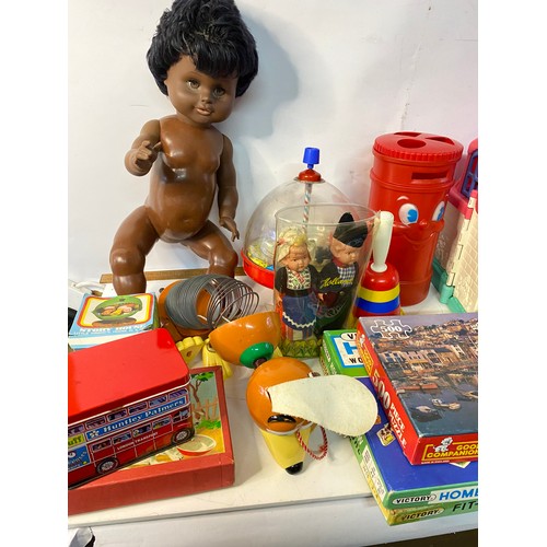 639 - Assortment of vintage toys including dolls, Fisher Price and Victory jigsaws.