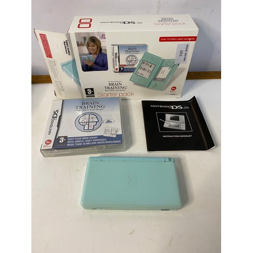 661 - Mint green Nintendo DS lite with games. No charger but in working order.