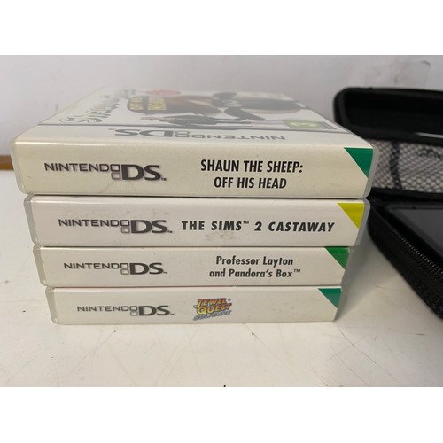 662 - Black Nintendo DS lite with games. No charger but in working order.