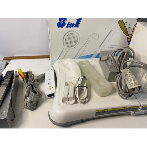 679 - Nintendo Wii console with games and accessories including fit board, Mariokart, sports and others.