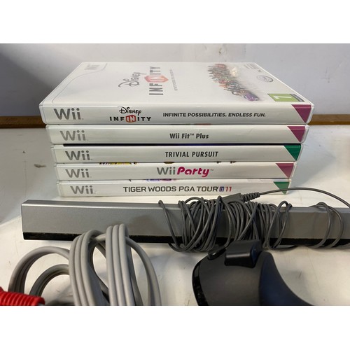 743 - Black Nintendo Wii with games and accessories in working order.