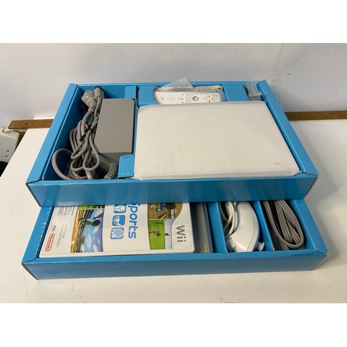 744 - Boxed Nintendo Wii with games and accessories including fit board, Skylanders bundle and more, in wo... 