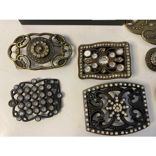 535 - Collection of vintage belt buckles in strong box.