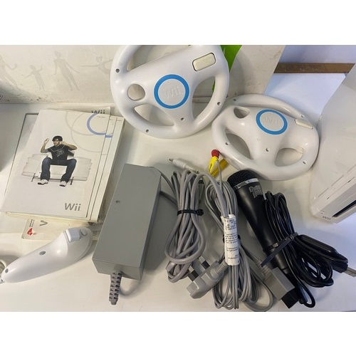 606 - Nintendo Wii console with games and accessories including fitboard.