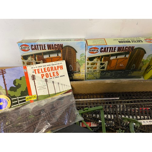 Box of model train accessories including track, Airfix models, scenery ...