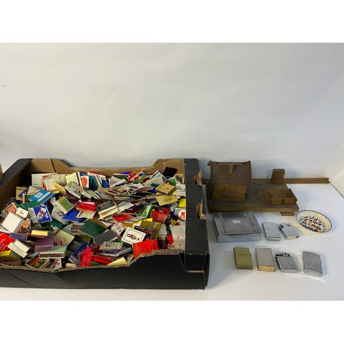 53 - Collection of tobacciana to include cigarette dispenser, matchbox holders, cigarette cases, and hund... 