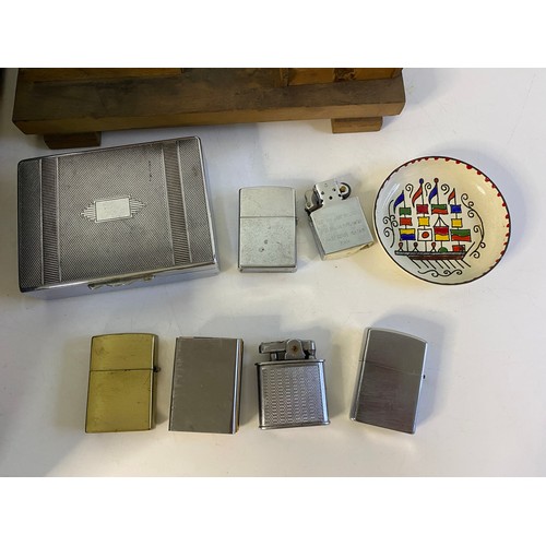 53 - Collection of tobacciana to include cigarette dispenser, matchbox holders, cigarette cases, and hund... 