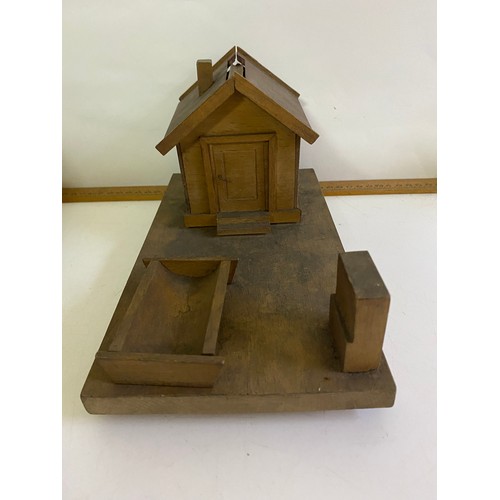 53 - Collection of tobacciana to include cigarette dispenser, matchbox holders, cigarette cases, and hund... 