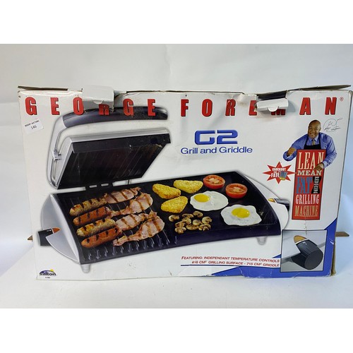 An unused George Foreman G2 grill and griddle