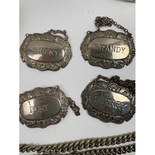 927 - Assortment of vintage curios to include Silver picture frame, pocket watch chains, napkin rings, spi... 