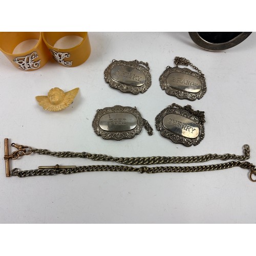 927 - Assortment of vintage curios to include Silver picture frame, pocket watch chains, napkin rings, spi... 
