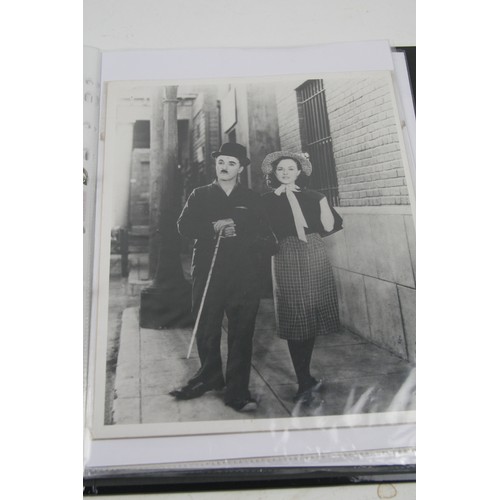 20 - Album of film lobby card photo's of John Wayne, Marx Bros, Charlie Chaplin and lots more