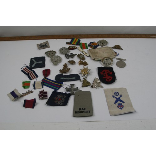 44 - Collection of Military cap badges, patches, ribbons and WW2 medal