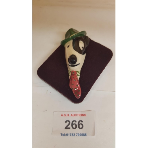 266 - POTTERY BROOCH OF A JACK RUSSELL WEARING A TIE & HAT