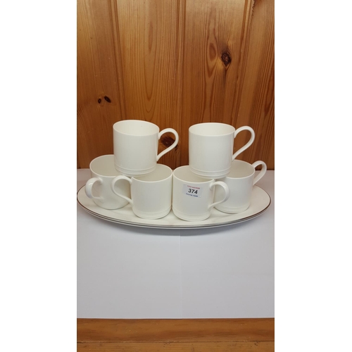 374 - WEDGWOOD WHITE CHINA MUGS (6) & OVAL PLATES (2)