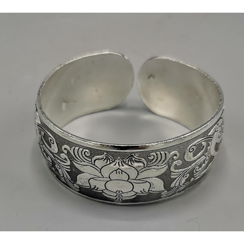 13 - TIBETAN SILVER CUFF BRACELET IN THE LOTUS FLOWER DESIGN