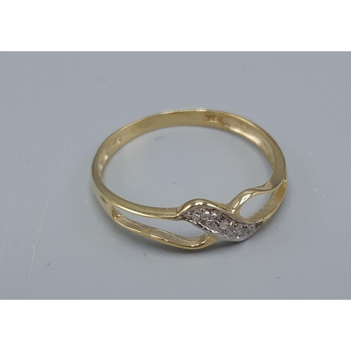 27 - 9ct GOLD THREE DIAMOND STONED CROSSOVER RING