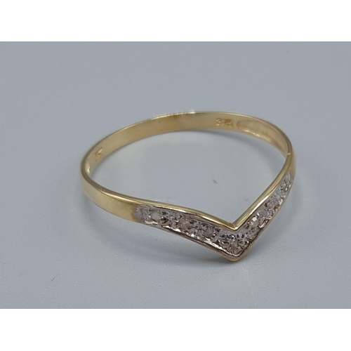 96 - 9ct GOLD SEVEN DIAMOND STONED WISHBONE RING