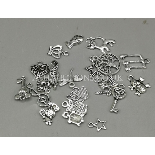 276 - PRESENTED AS SILVER CHARMS (20)