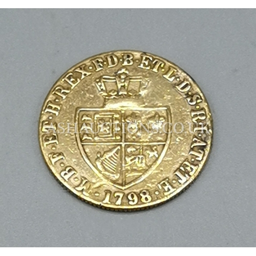301 - PRESENTED AS A 1798 HALF GUINEA 22ct COIN