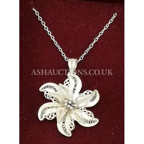 77 - PRESENTED AS A SILVER FILIGREE FLOWER DESIGN NECKLACE