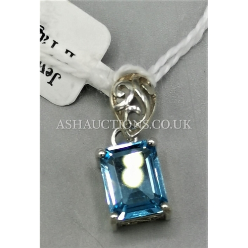 554 - PRESENTED AS A SILVER (Stamped 925)BLUE STONE SET PENDANT