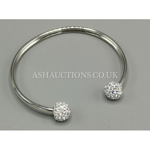 144 - PRESENTED AS A SILVER (925) & DIAMANTE TORQ BANGLE