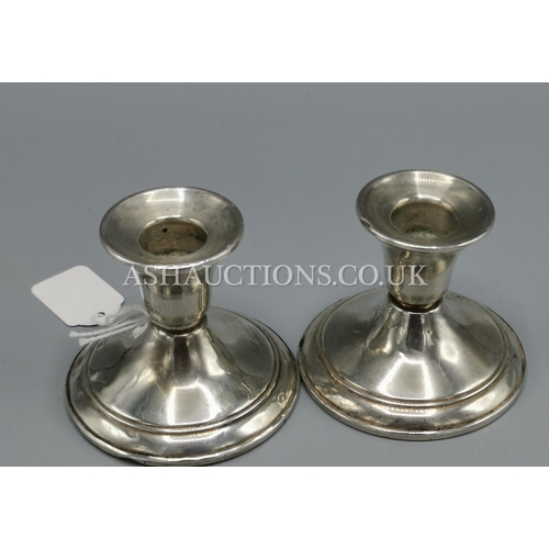 244 - PRESENTED AS A PAIR OF STERLING SILVER CANDLESTICKS By BACKES