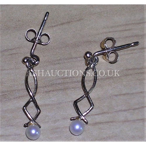 312 - PRESENTED AS A PAIR OF 9ct GOLD PAIR OF DROP PEARL EARRINGS