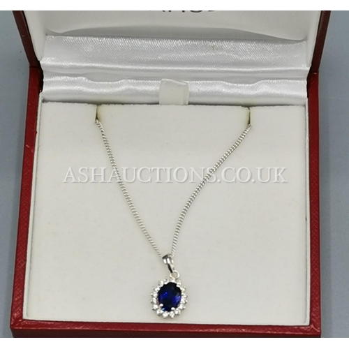 393 - PRESENTED AS A SILVER (925) BLUE & WHITE STONE SET PENDANT ON A 46cm CHAIN (H Samuel)