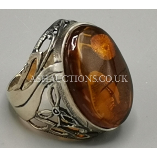 417 - PRESENTED AS A STERLING SILVER AND BALTIC AMBER RING