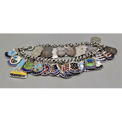 911 - PRESENTED AS A SILVER CHARM BRACELET (Every Link Stamped) With 30 SILVER TRAVEL CHARMS. (Weight 50.4... 