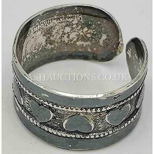 294 - PRESENTED AS A STERLING SILVER RING DECORATED WITH HEARTS