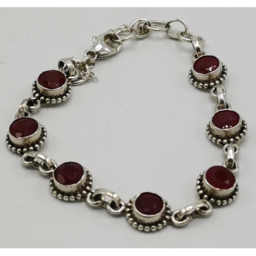 1211 - PRESENTED AS A SILVER (925) RUBY STONED BRACELET (Weight 10.5 Grams)