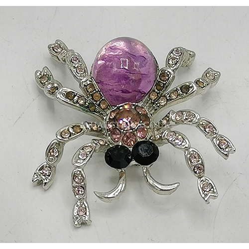 1086 - WHITE METAL STONE SET BROOCH MODELLED AS A SPIDER