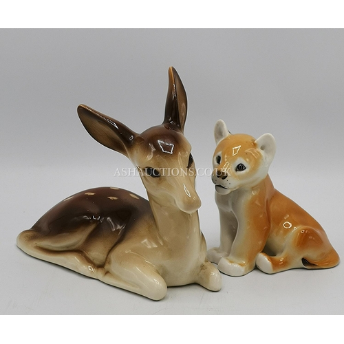 1159 - U S.S.R. MODEL OF A LION CUB (Faded Backstamp) TOGETHER WITH A POTTERY MODEL OF A FAWN (Unmarked)