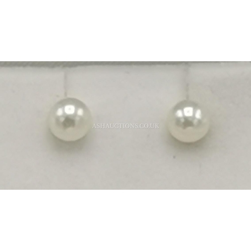 953 - PRESENTED AS A PAIR OF 9ct GOLD / PEARL EARRINGS  (Weight____________)